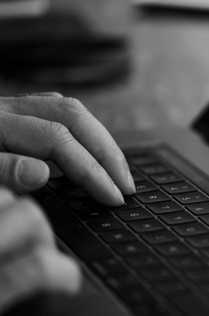 developer typing on laptop creating affordable websites for small businesses in los angeles